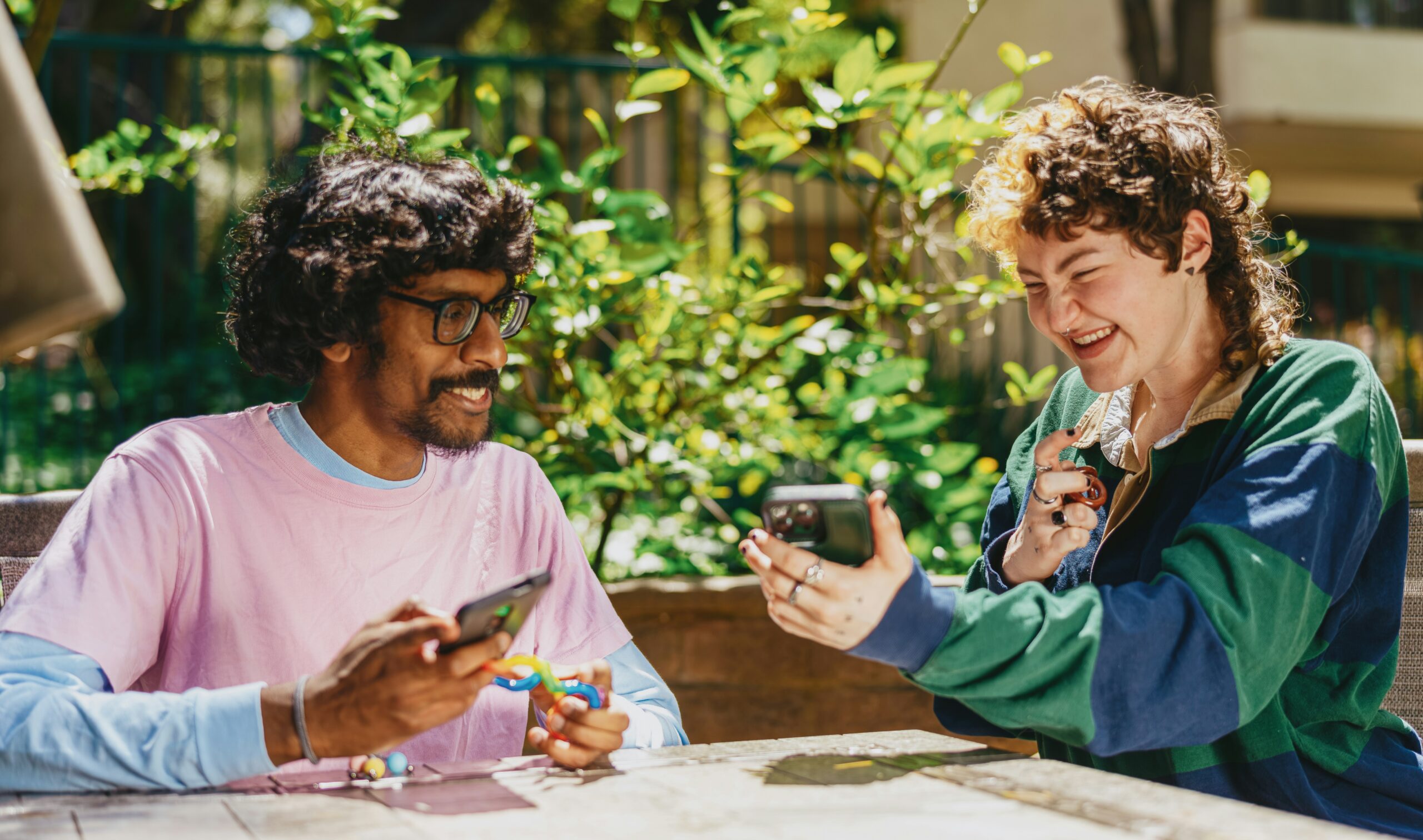 Two students talking and laughing.
