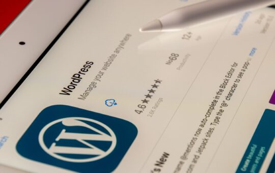 WordPress App displayed on an tablet with stylist in shot.